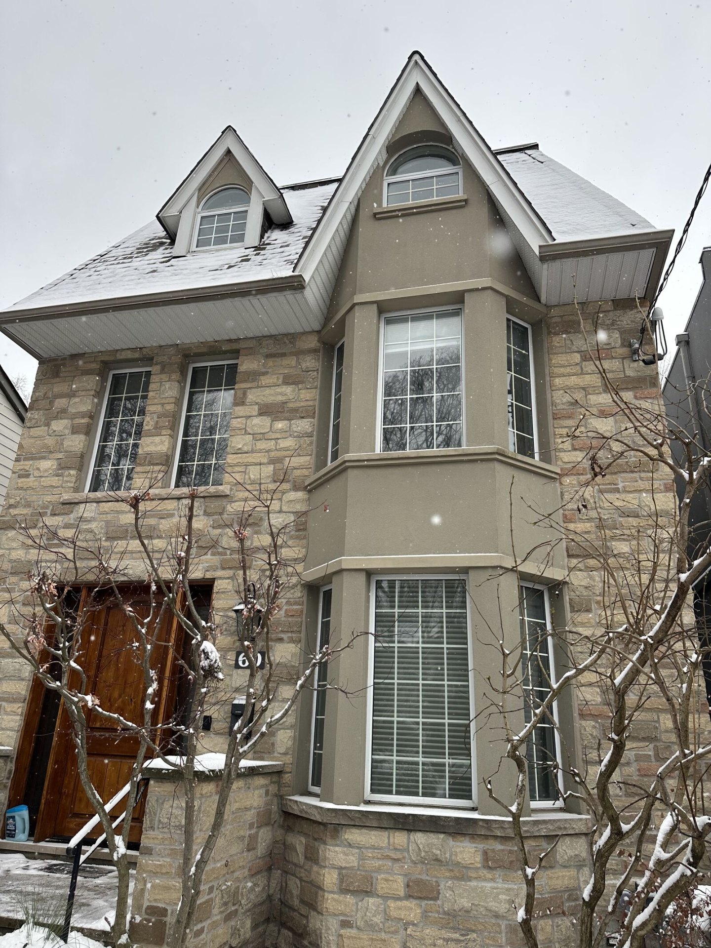 Stone-fronted home with the original light-framed windows