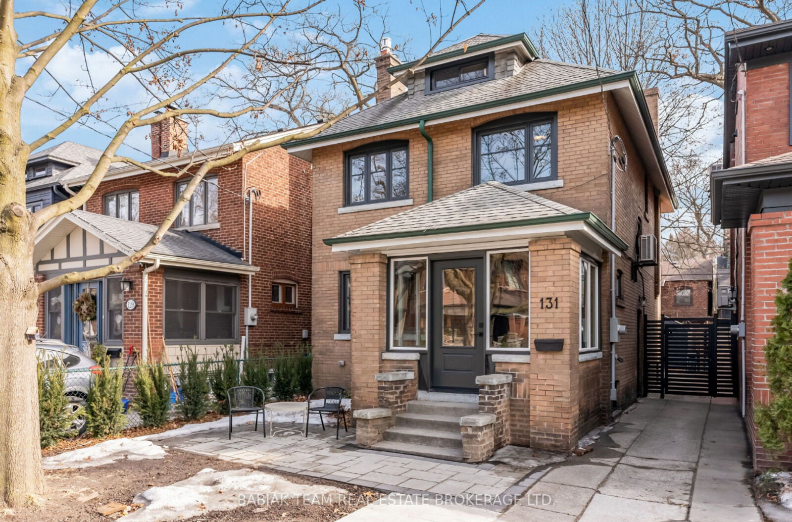 Front elevation with new dark-framed windows